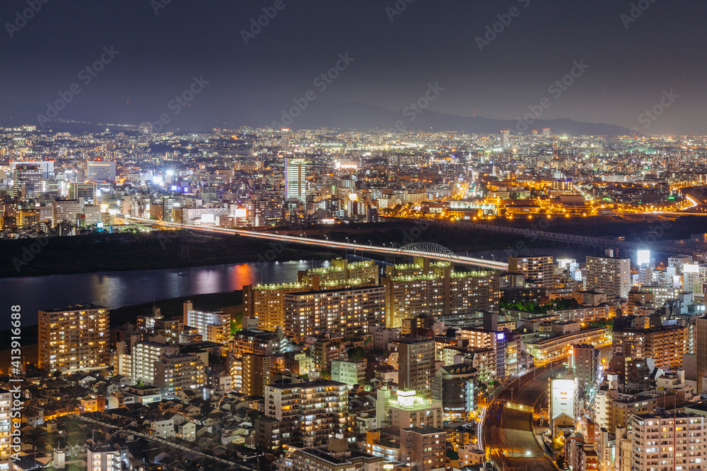 High angle view of illuminated cityscape against sky at night High angle view of illuminated cityscape against sky at night