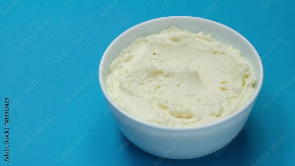 Cream cheese with spoon, sour cream, fresh greek yogurt close up Cream cheese with spoon, sour cream, fresh greek yogurt close up