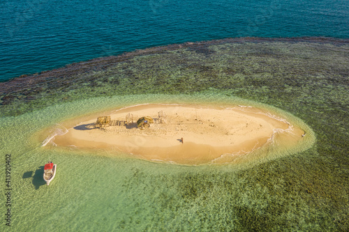 Aerial view of a small boat on Cayo Arena paradise island in Monte Cristi state, Dominican Republic. photo