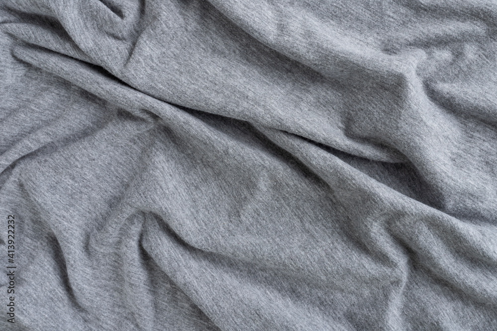 Crumpled linen cloth texture. Wrinkled textile. Grey Crumpled linen cloth texture. Wrinkled textile. Grey