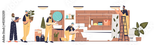 Renovation and repair in bathroom: team of repairmen and designer working on new bath interior