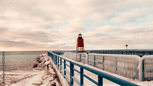 Lake Michigan Lighthouse. Charlevoix winter lighthouse scene. Travel graphic.