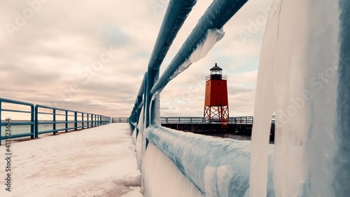 Lake Michigan Lighthouse. Charlevoix winter lighthouse scene. Travel graphic.