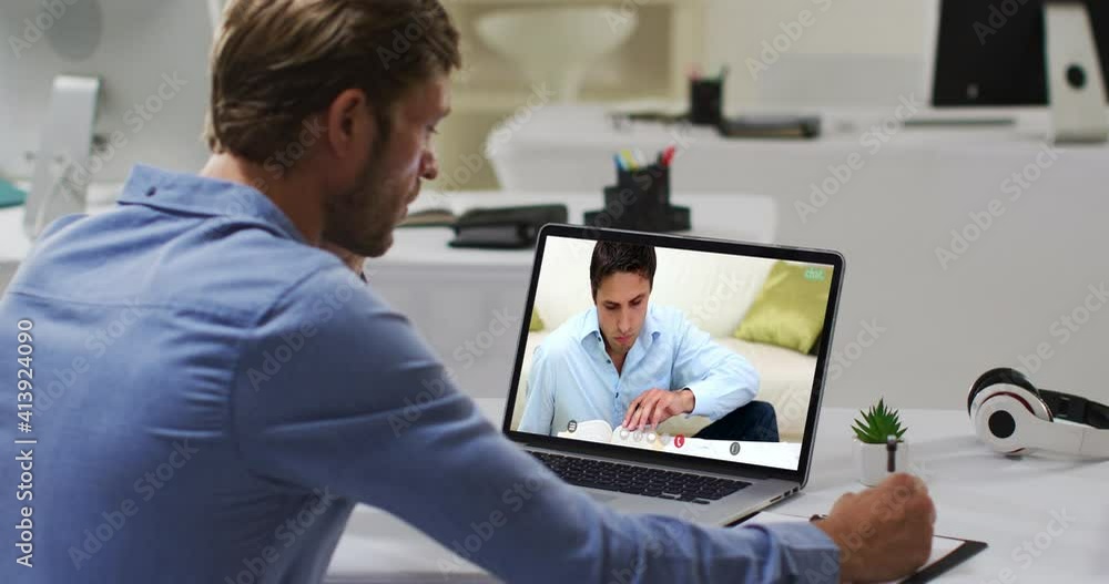 Caucasian male teacher using laptop on video call with male student, making notes Caucasian male teacher using laptop on video call with male student, making notes
