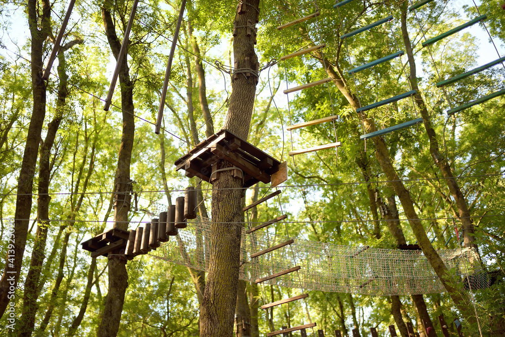 Adventure Park for children - ropes, stairs, bridges in woods