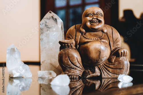 Hotei and crystals for meditation photo