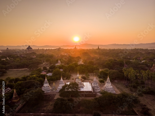 Aerial view of Minochantha, a buddhist temple with five domes at sunset, Nyaung-U, Myanmar. photo