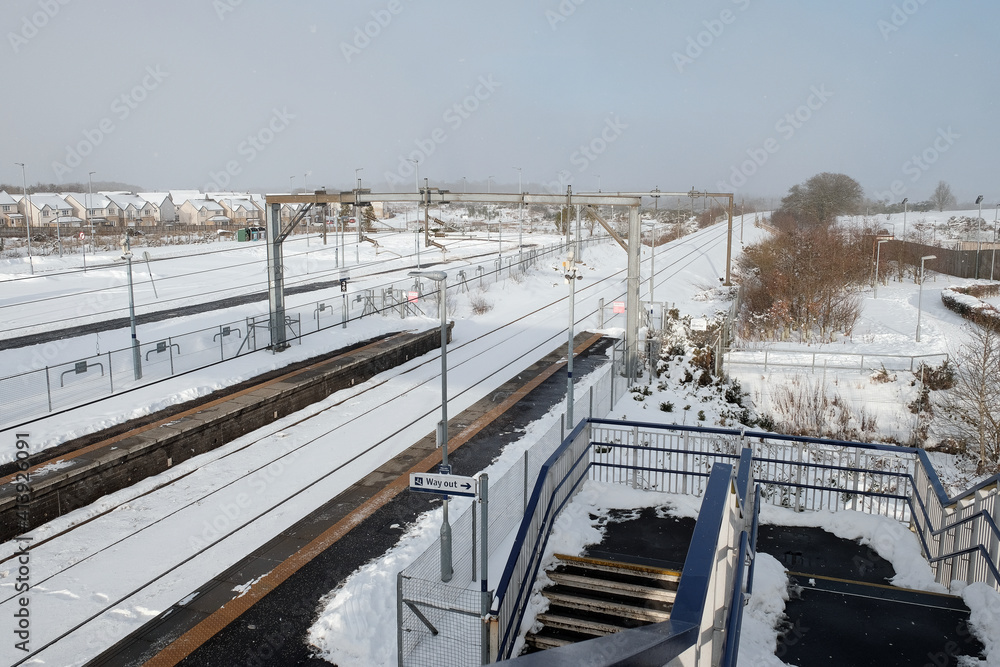 Railway station in winter with snow in Armadale, West Lothian, Scotland. FEBRUARY 10, 2021