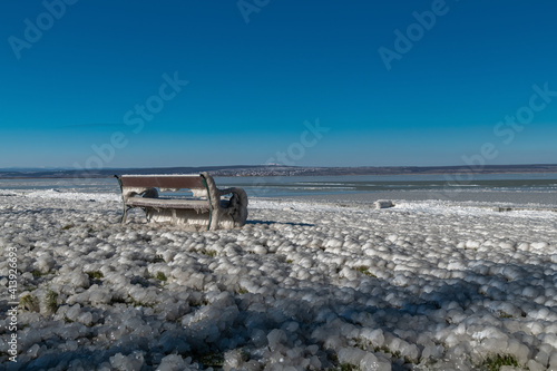 Completly frozen bench at Promenade in Illmitz, Neusiedlersee, Austria