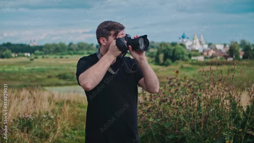 Male Travel Photographer photographs landmarks. Male Travel Photographer photographs landmarks.