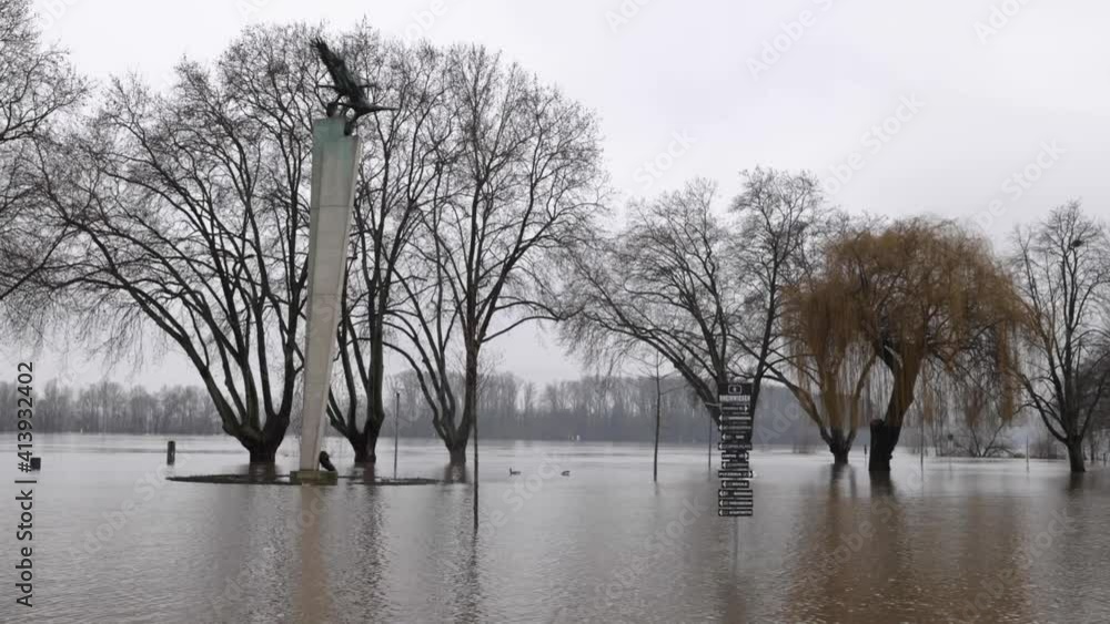 Rhine River Flooding In The Surroundings Of Statue Park in Germany During Daytime - Wide Shot Rhine River Flooding In The Surroundings Of Statue Park in Germany During Daytime - Wide Shot