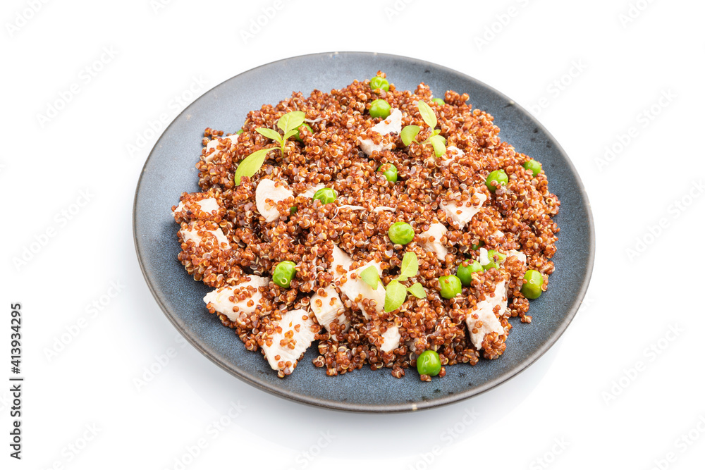 Quinoa porridge with green pea and chicken on ceramic plate isolated on white background. Side view. Quinoa porridge with green pea and chicken on ceramic plate isolated on white background. Side view.