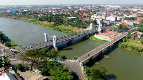 Panoramic aerial view of Brantas river and Brawijaya bridge in Kediri, Indonesia photo