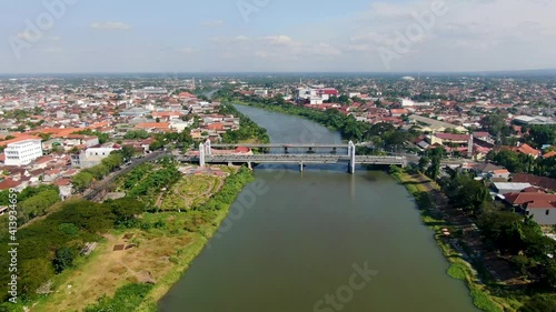 Aerial view of road traffic crossing Brawijaya bridge in Kediri , Java Indonesia photo