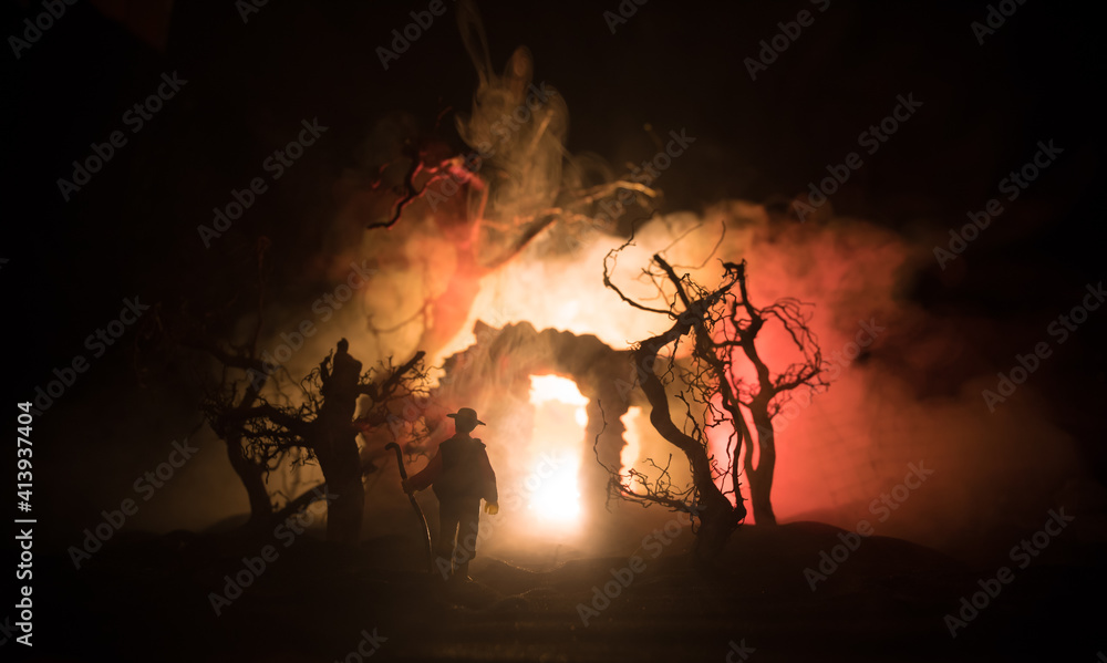 Old stone house burning uncontrollable in the night. A fire in a country house. Creative artwork decoration.