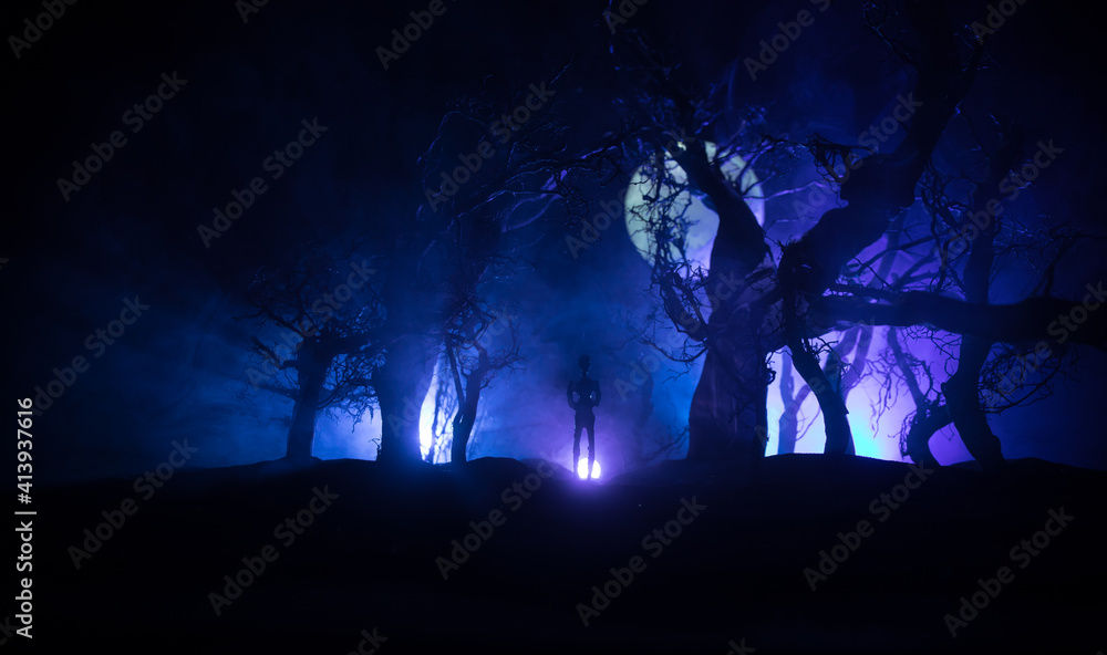 bloodthirsty zombies attacking. hungry zombies in the woods. Silhouettes of scary zombies walking in the forest at night