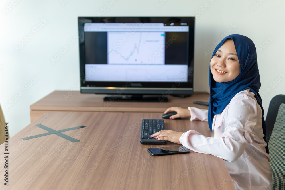 Malay lady using laptop at home Malay lady using laptop at home