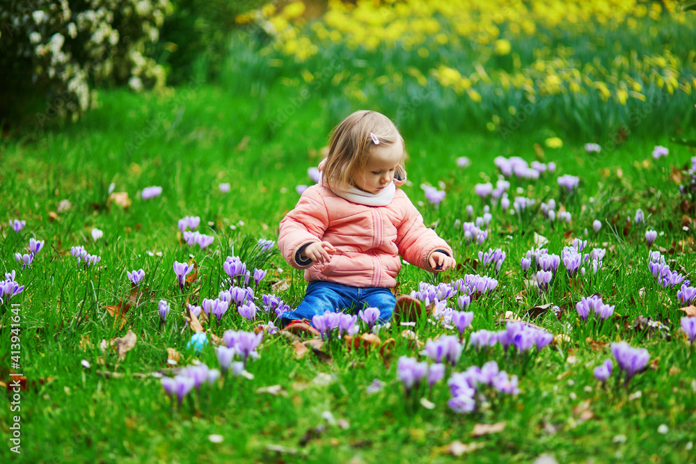 Cute little girl playing egg hunt on Easter Cute little girl playing egg hunt on Easter
