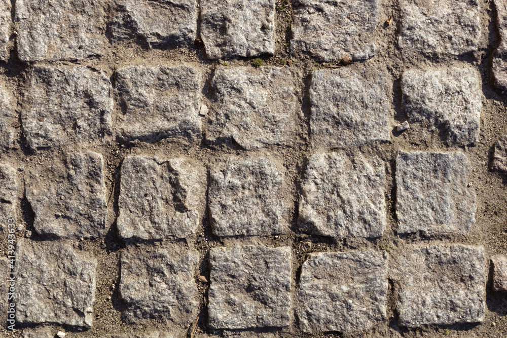 flat bricks of a square shape, with an uneven surface, between which the earth flat bricks of a square shape, with an uneven surface, between which the earth