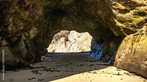A small cave in the bay of shark fin, beautiful beach landscape on the coast of the California Highway, ocean, rocks, great sky, clear sunny weather.