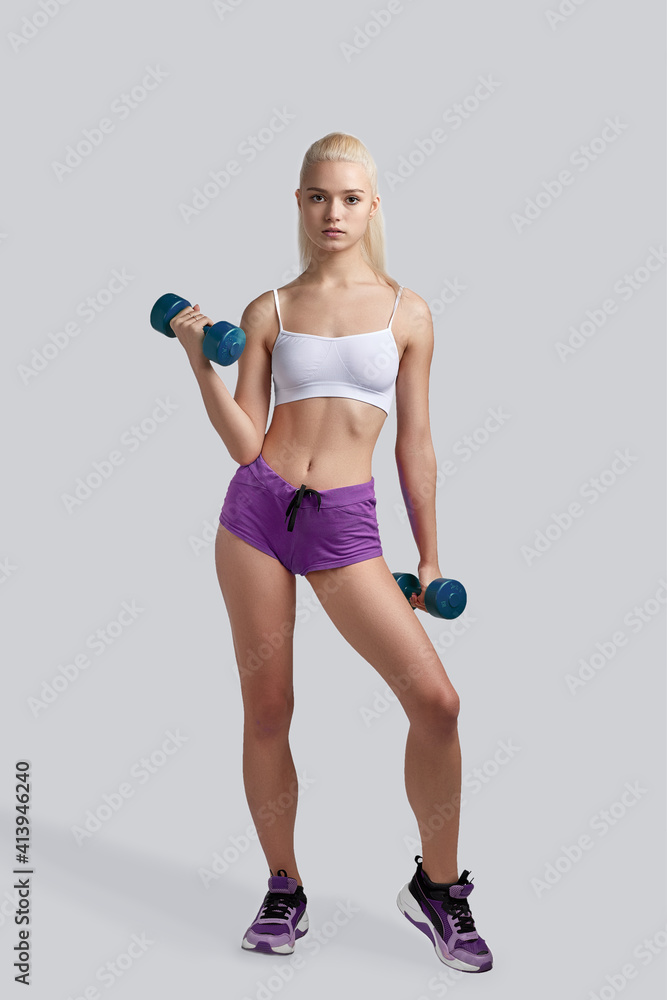 Fototapeta premium Beautiful fitness girl working out