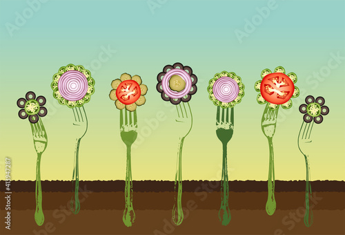 A row of fresh vegetable flowers on forks in the garden at sunrise
