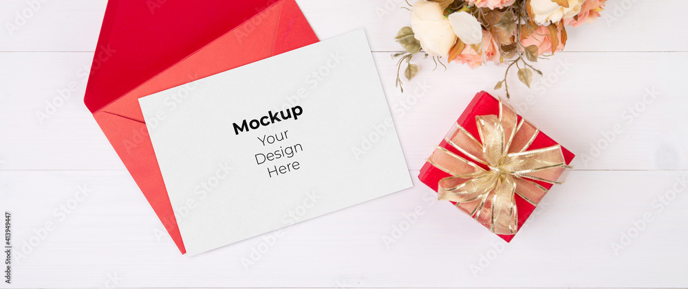 Φωτογραφία Valentine day, greeting card mockup and letter and flower on wooden table, postcard blank and gift box with romance on desk, present in anniversary and celebration, top view, holiday concept