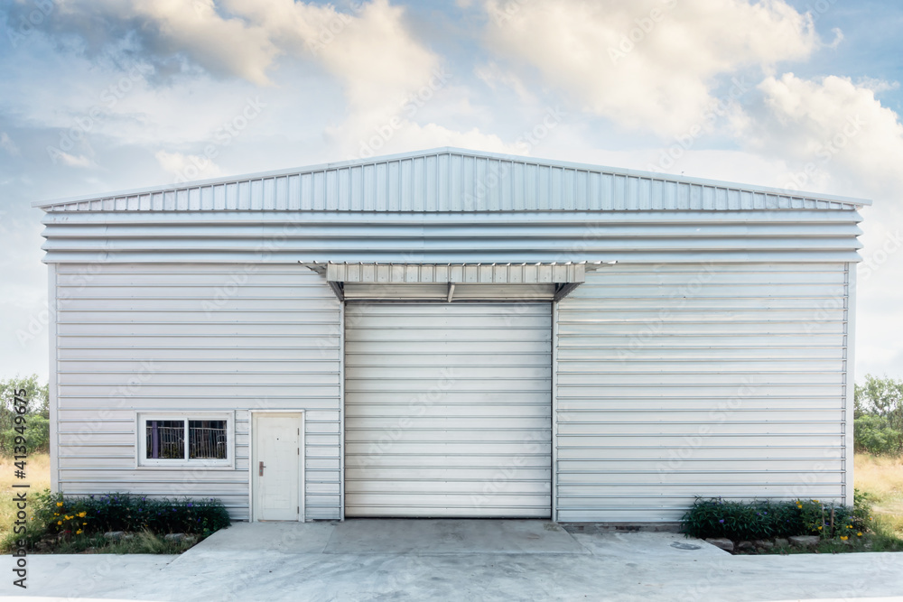 Steel Shutter Roller Door of Factory Warehouse Workshop for Materials Storage, Front View of Rolling Metal Doors for Access and Security. Gate Building Structure of Warehouses for Store