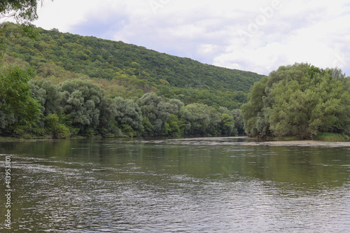 Very beautiful river water surface. Natural green background. photo