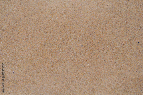 Background from decorative plaster, fine sand, texture rough surface close-up