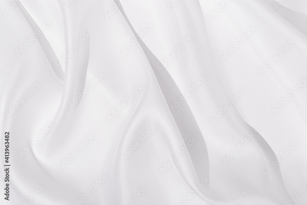 Texture of white silk cloth, textile background, drapery and pleats on delicate fabric.