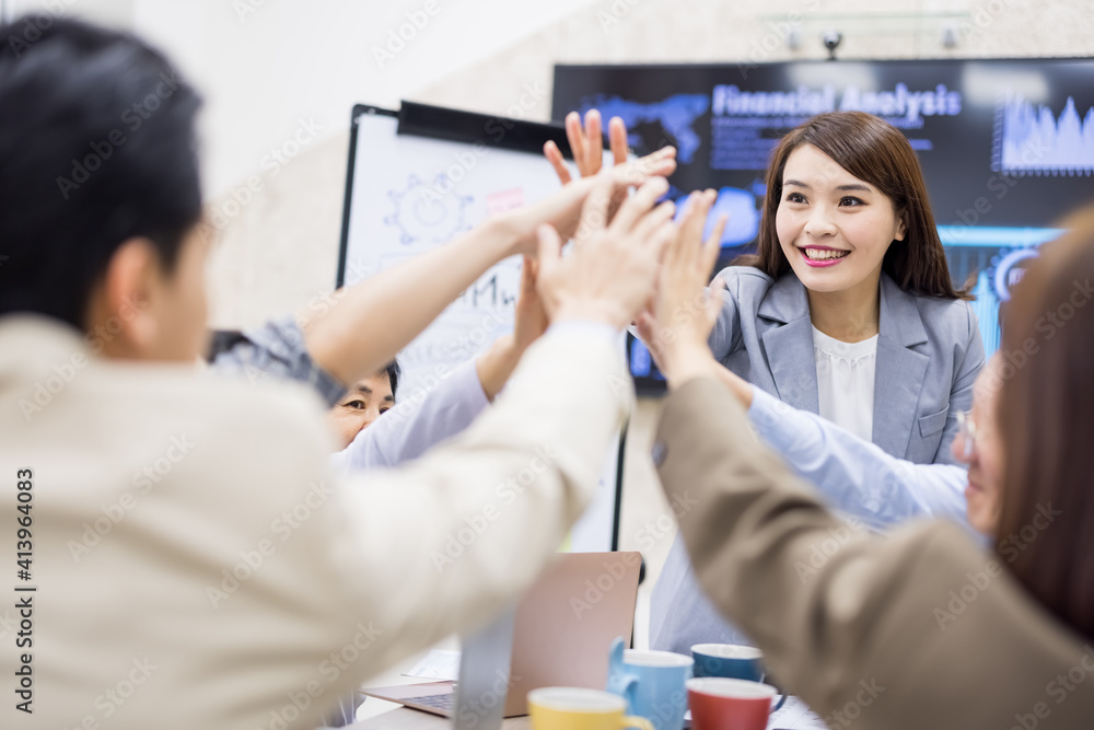 Coworkers discuss at table