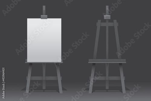 Wooden easel stand with blank canvas on white background