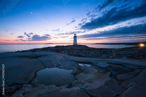 The Peggy's Cove Lighthouse landscape along the rugged rocks of the Atlantic Coast Nova Scotia Canada. The most visited tourist location in the Atlantic Canada and famous Lighthouse captured with vibr