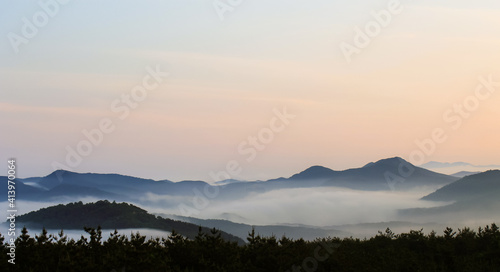 foggy mountain landscape at sunset
