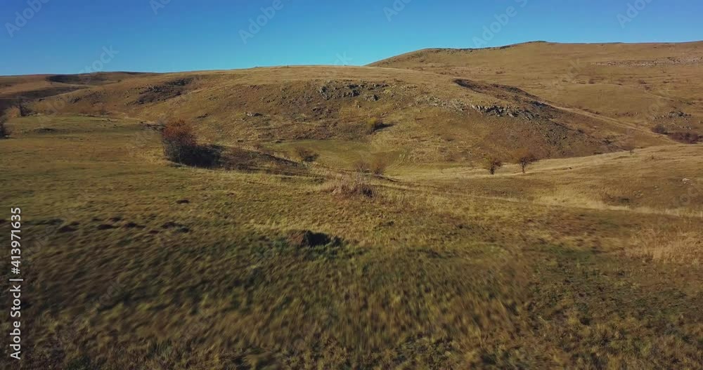 aerial view of beautiful green meadow with blue sky in the middle of nowhere aerial view of beautiful green meadow with blue sky in the middle of nowhere