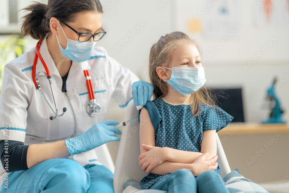 Doctor vaccinating child Doctor vaccinating child