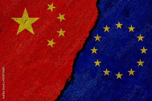 china and eu flags painted on concrete wall photo