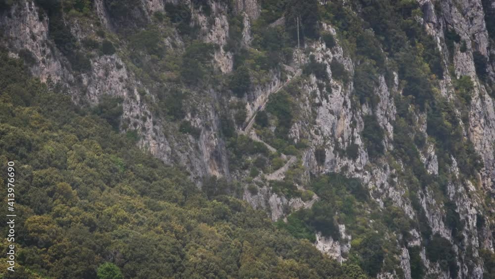 Tourists go up a very long staircase in Capri, Italy Tourists go up a very long staircase in Capri, Italy
