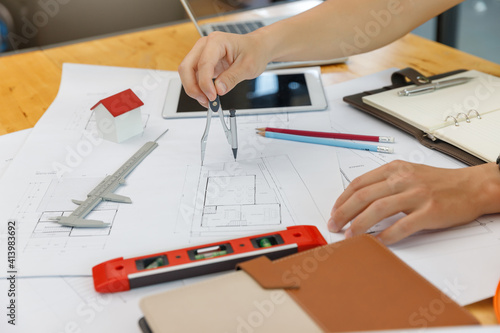 Engineer and Architect concept, Engineer Architects and Interior designer working with blueprints