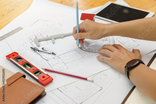 Engineer and Architect concept, Engineer Architects and Interior designer working with blueprints