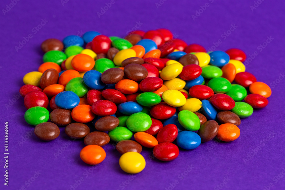 Pile of Rainbow Colored Candy Coated Chocolate Buttons Pile of Rainbow Colored Candy Coated Chocolate Buttons