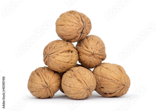 Walnuts in the shell isolated on white background