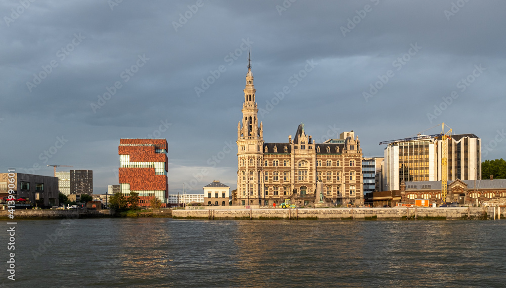 Skyline of the city of Antwerp from the River Scheldt at sunset