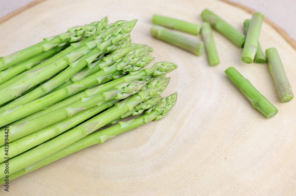 Fresh green asparagus on cutting board. Fresh green asparagus on cutting board.