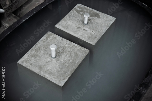 Concrete cube block for strength testing soak in water photo