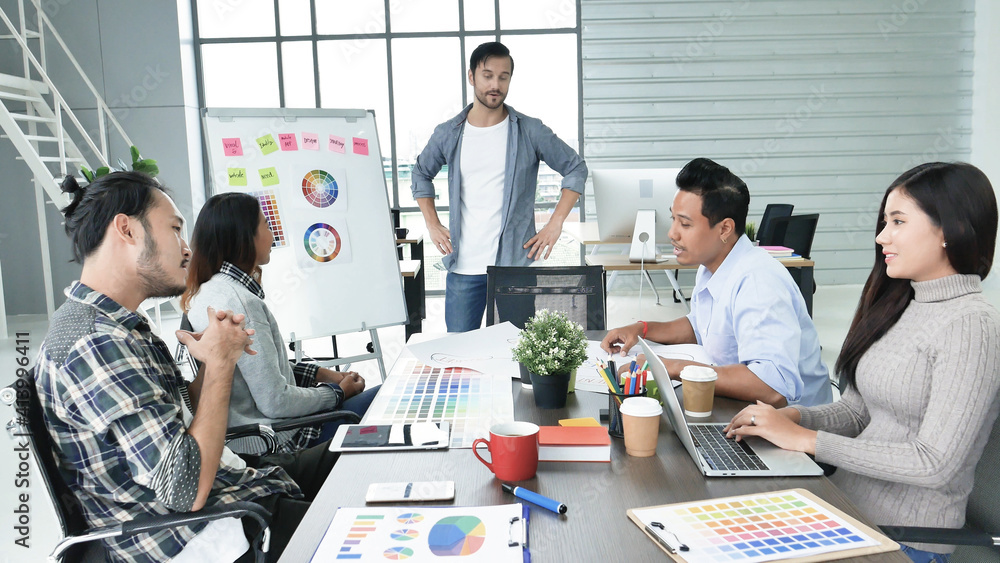 Diversity multiethnic team group of business people meeting in conference room brainstorming with business graph, chart, data info. Teamwork collaborate business team meeting together trust partners