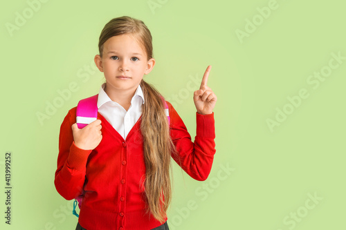 Little schoolgirl with rais...