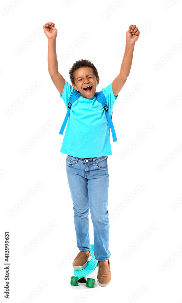Happy little African-American schoolboy with skateboard on white background Happy little African-American schoolboy with skateboard on white background