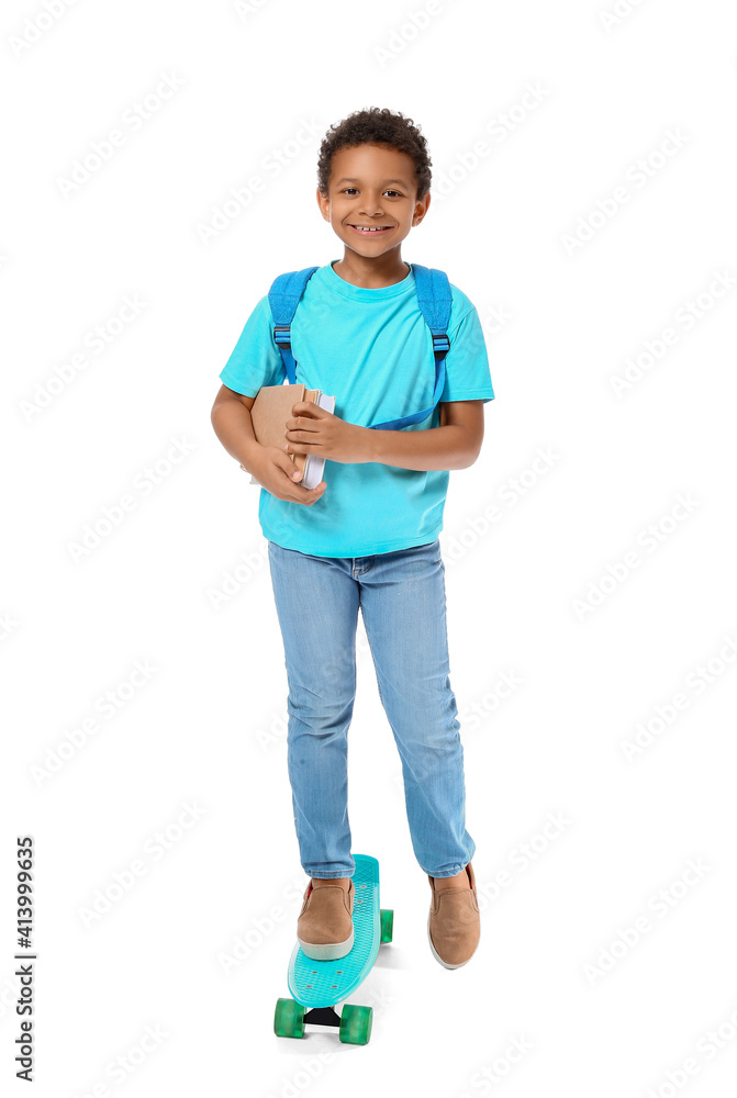 Little African-American schoolboy with skateboard on white background Little African-American schoolboy with skateboard on white background